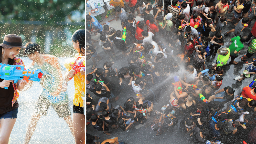 Songkran Fesztivál résztvevői vízipisztolyokkal lőnek egymásra